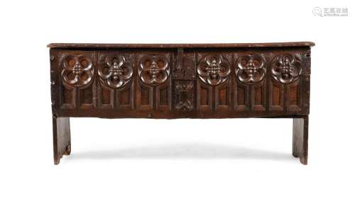 A CARVED OAK COFFER, IN GOTHIC STYLE, MID 17TH CENTURY AND L...