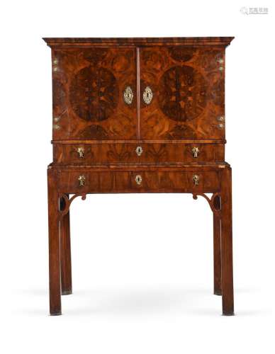A WILLIAM AND MARY OYSTER VENEERED WALNUT CABINET, CIRCA 169...