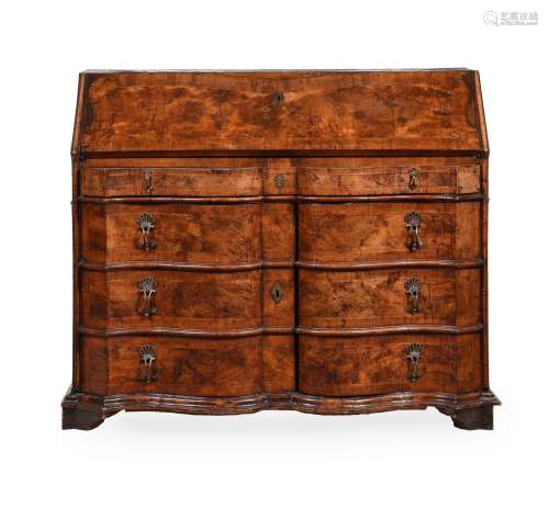 A WALNUT SERPENTINE FRONTED BUREAU, PROBABLY SOUTH GERMAN, S...