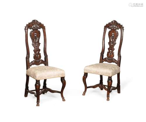 A PAIR OF DUTCH CARVED WALNUT SIDE CHAIRS, CIRCA 1740