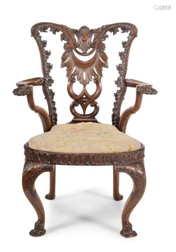A CARVED MAHOGANY OPEN ARMCHAIR, IN GEORGE II STYLE, LATE 19...