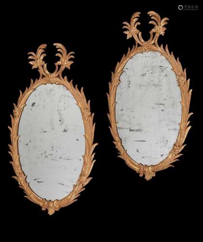 A PAIR OF GEORGE II GILTWOOD WALL MIRRORS, IN THE MANNER OF ...
