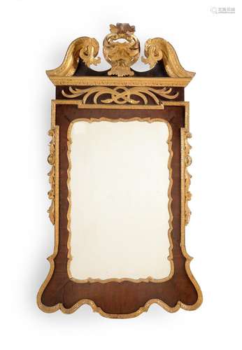 A GEORGE II MAHOGANY AND CARVED GILTWOOD MIRROR, CIRCA 1750