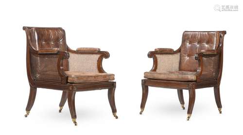 A PAIR OF MAHOGANY LIBRARY BERGERE ARMCHAIRS, IN REGENCY STY...