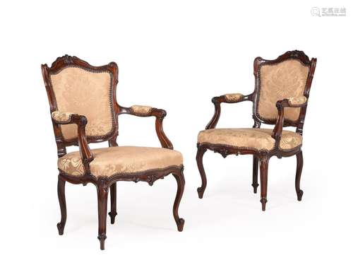 A PAIR OF GEORGE III CARVED MAHOGANY AND UPHOLSTERED ARMCHAI...