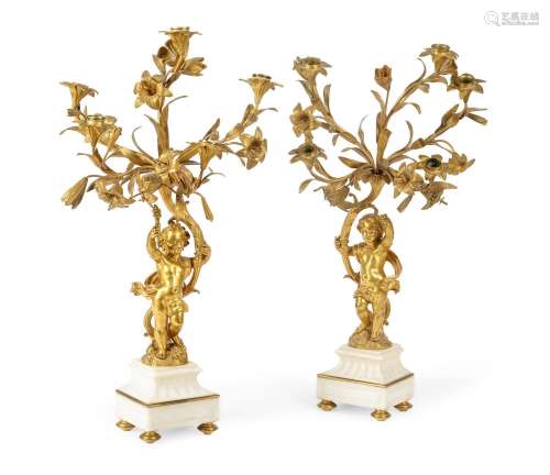 A PAIR OF FRENCH ORMOLU AND WHITE MARBLE FIVE-LIGHT CANDELAB...