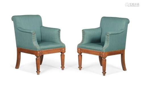 A PAIR OF EARLY VICTORIAN OAK LIBRARY ARMCHAIRS, IN THE MANN...