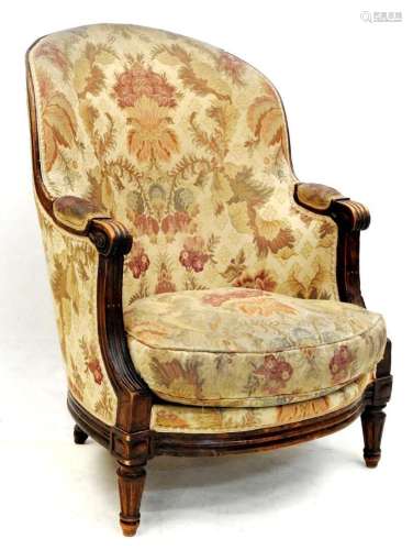 Bergère confortable en bois naturel de style Louis XVI.<br /...
