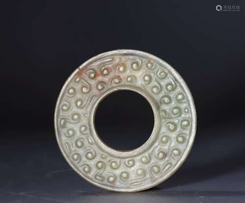 Spring and autumn jade disc with relief of spots