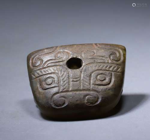 Spring and autumn jade carved mask ornament with a hole in t...