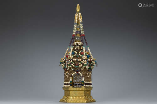 Buddha niche made of precious stone beads located on a lotus...