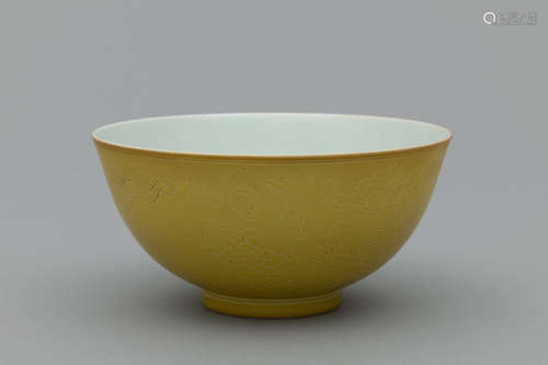 Qing yellow bowl with engraving of dragons