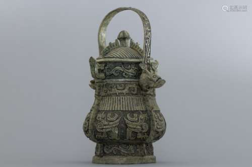 Shang bronze handled wine-container with with birds reliefs