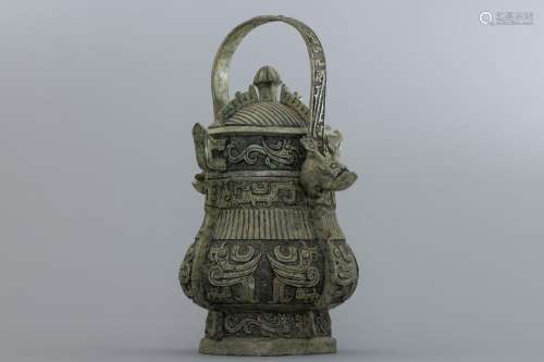 Shang bronze handled wine-container with with birds reliefs