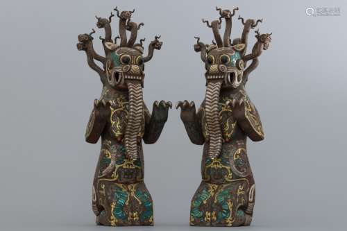 Pair of Warring States period gold and silver inlaid monster...