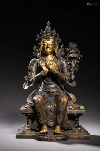 EARLY QING: A GILT BRONZE SEATED BUDDHA STATUE