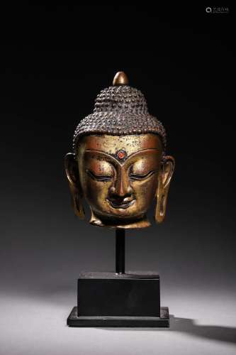 MING: A GILT BRONZE BUDDHA HEAD