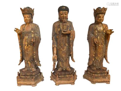 MING DYNASTY, A GROUP OF THREE GOLD PASTED BUDDHA