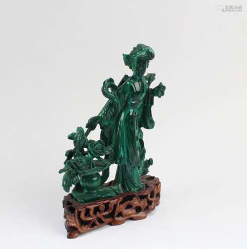A CARVED MALACHITE FIGURINE WITH STAND