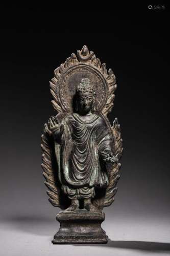 10TH CENTURY: A BRONZE STANDING BUDDHA STATUE