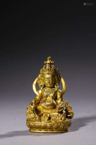 MING: A GILT BRONZE JAMBHALA STATUE