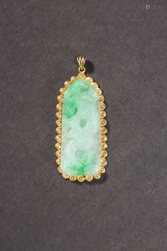 REPUBLIC PERIOD: A JADEITE JADE WITH ENCASED GOLD RIM PENDAN...