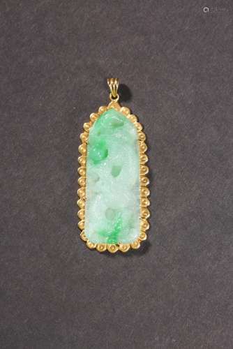 REPUBLIC PERIOD: A JADEITE JADE WITH ENCASED GOLD RIM PENDAN...