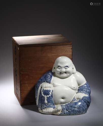 QING: A BLUE AND WHITE PORCELAIN SEATED MAITREYA STATUE