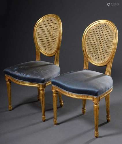 Pair of heavily gilded chairs in