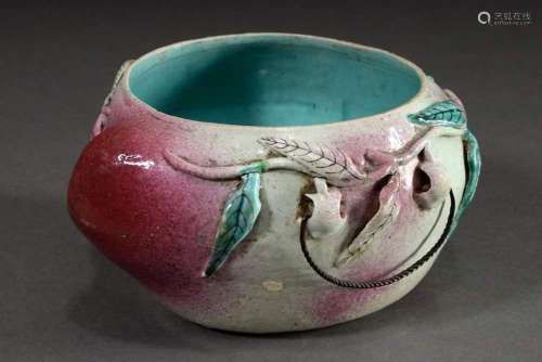 Ceramic pot in the shape of a peach with metal handles on th...
