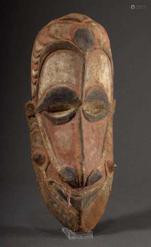 Elongated post or house mask, wood carved and colourfully pa...