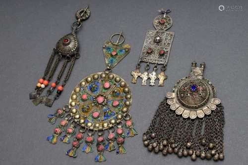 4 Various pieces of silver and metal ethno pendants in diffe...