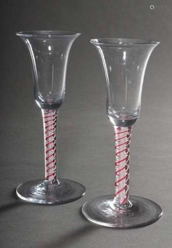 Pair of goblets on a round base with fused red and white spi...