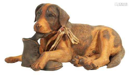 A 20TH CENTURY BLACK FOREST CARVED SCULPTURE DEPICTING A DOG...