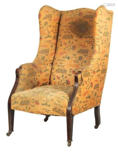 AN EDWARDIAN UPHOLSTERED INLAID MAHOGANY WINGBACK ARMCHAIR