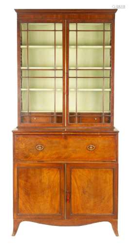 A GEORGE III MAHOGANY SECRETAIRE BOOKCASE IN THE MANNER OF G...