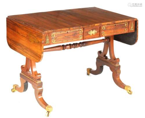 A REGENCY BRASS MOUNTED FIGURED ROSEWOOD SOFA TABLE