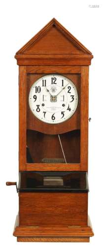 AN EARLY 20TH CENTURY OAK CASED INTERNATIONAL TIME RECORDER ...