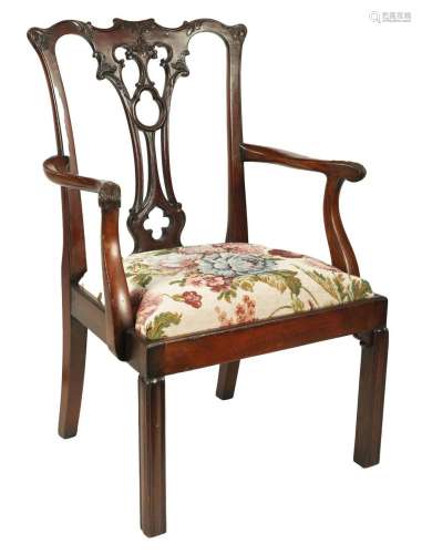 A CHIPPENDALE STYLE CARVED MAHOGANY CHILD S OPEN ARMCHAIR