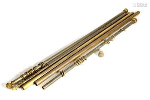 A SELECTION OF FIVE BRASS CURTAIN POLES