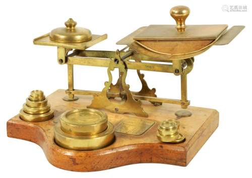 A SET OF LATE 19TH CENTURY BRASS PARCEL SCALES AND WEIGHTS