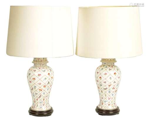 A PAIR OF LARGE PORCELAIN BALUSTER SHAPED TABLE LAMP STANDS