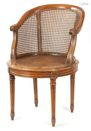 A LATE 19TH CENTURY FRENCH BERGERE REVOLVING DESK CHAIR