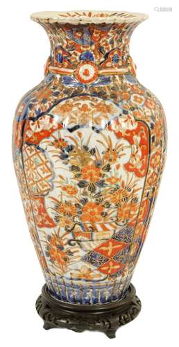 A 19TH CENTURY IMARI RIBBED OVOID VASE ON STAND