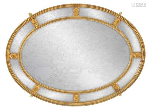 A 19TH CENTURY ADAM STYLE GILT OVAL HANGING MIRROR