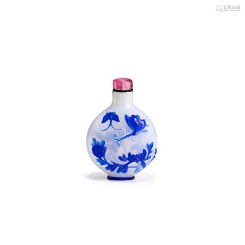 A BLUE OVERLAY ON OPALESCENT GLASS SNUFF BOTTLE Imperial, at...