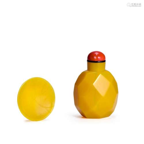 A YELLOW OCTAGONAL MULTI-FACETED GLASS SNUFF BOTTLE AND SNUF...