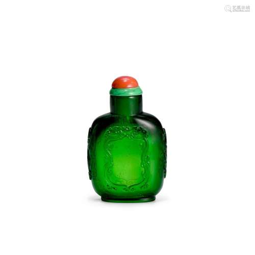 AN EMERALD-GREEN CARVED GLASS SNUFF BOTTLE Imperial, attribu...