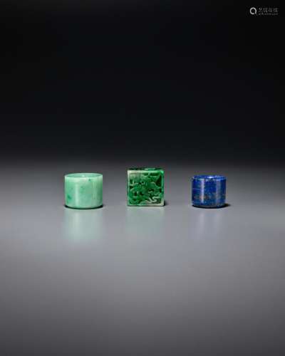 TWO JADEITE AND ONE LAPIS LAZULI ARCHER'S RINGS Late Qin...