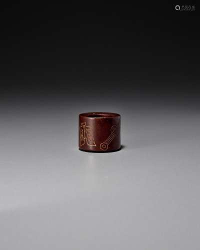 AN INCISED SANDALWOOD ARCHER'S RING 1842 (or 1902)